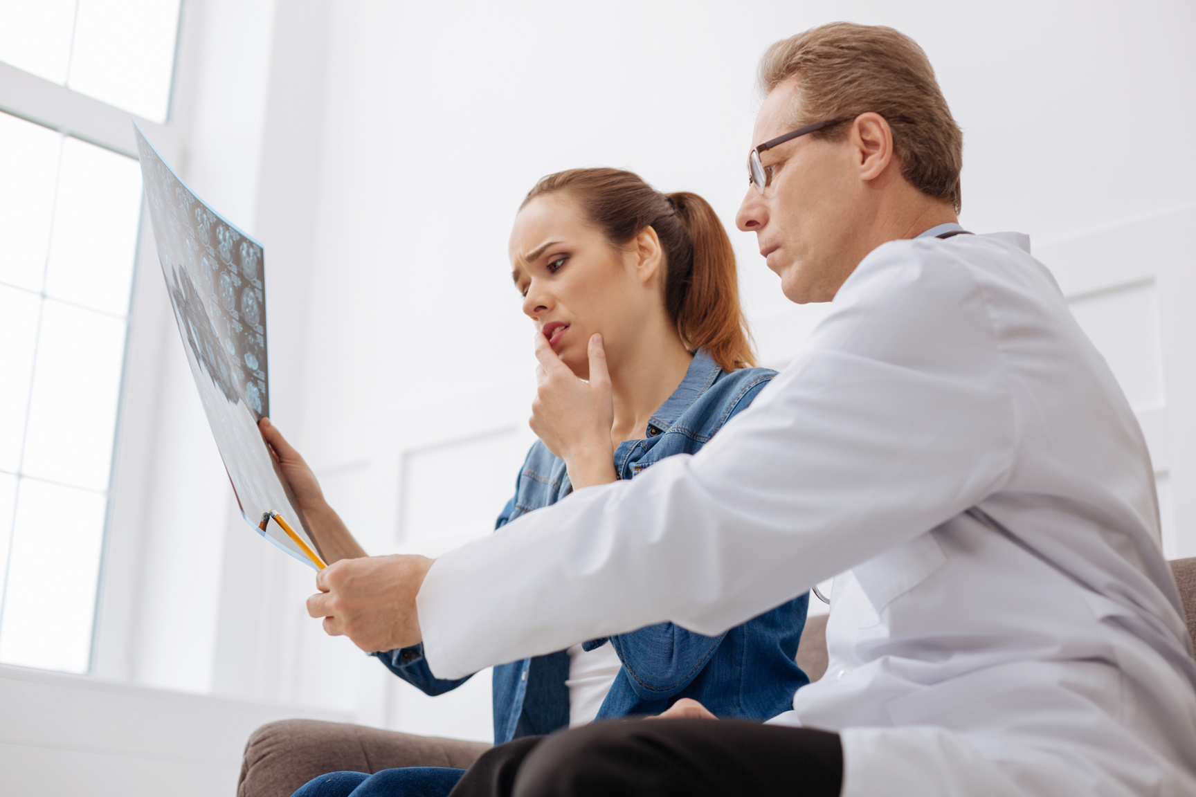 Qualified surgeon pointing out causes of the disease
