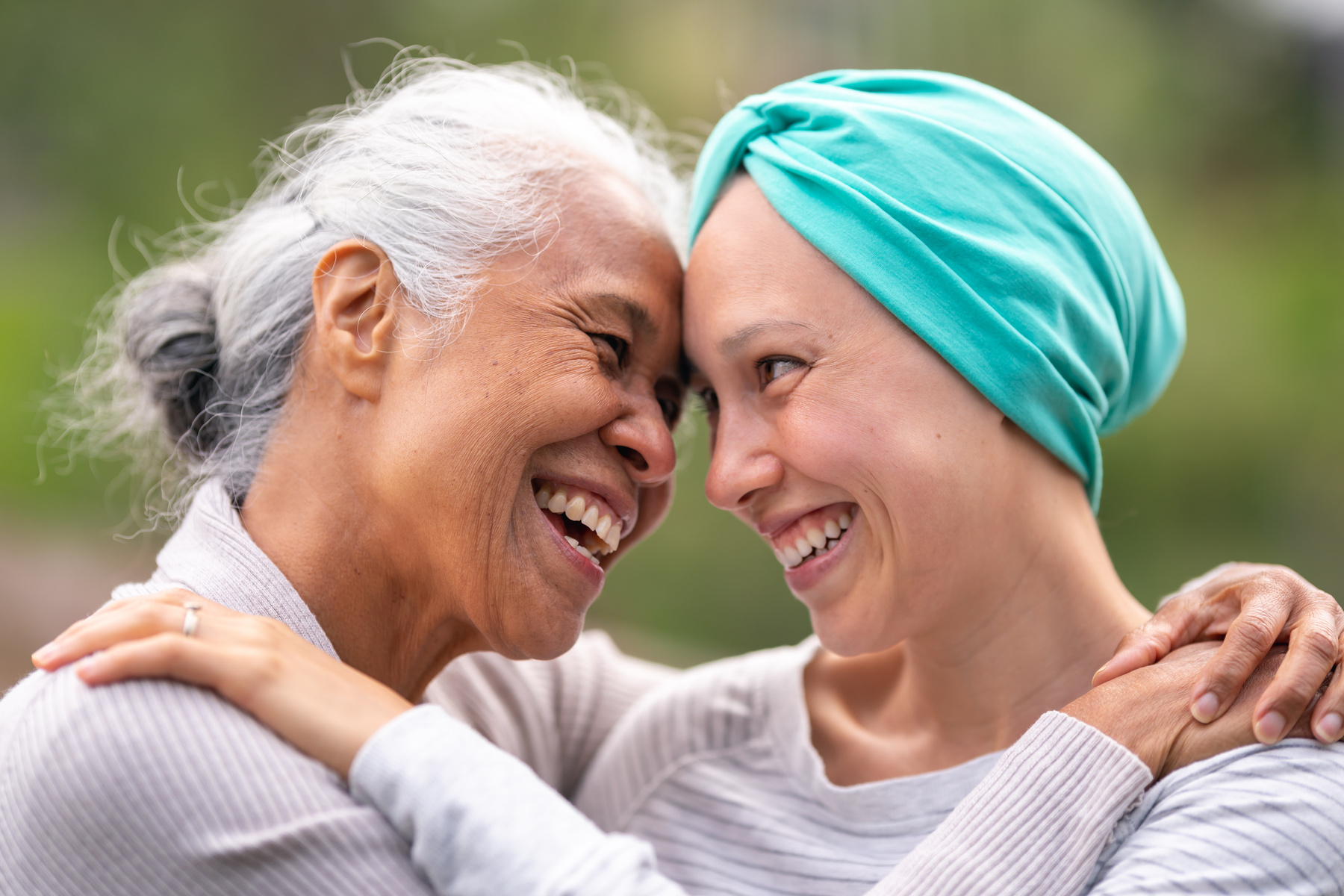 Recovering cancer patient embracing her mother